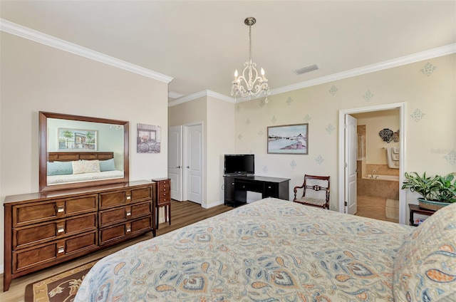 bedroom featuring a chandelier, crown molding, ensuite bath, and hardwood / wood-style flooring