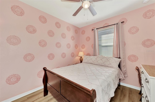 bedroom with ceiling fan and light wood-type flooring