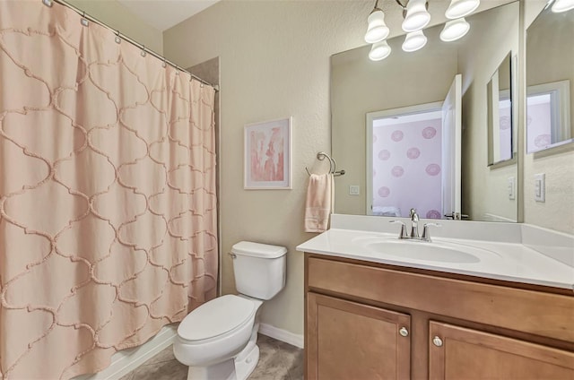 bathroom with toilet and vanity