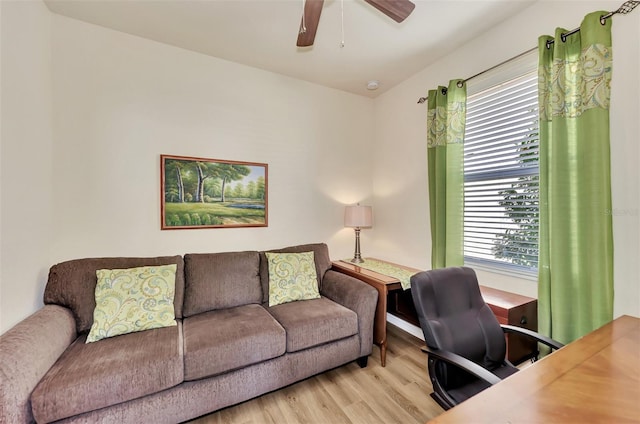 office space with ceiling fan and light wood-type flooring