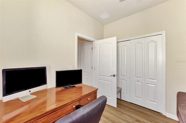 office space with light hardwood / wood-style flooring