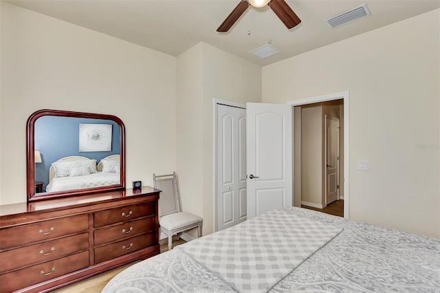 bedroom featuring a closet, ceiling fan, and light wood-type flooring