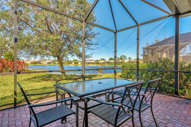 unfurnished sunroom with a water view