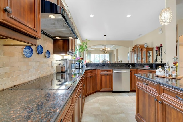 kitchen with pendant lighting, a chandelier, range hood, backsplash, and stainless steel dishwasher