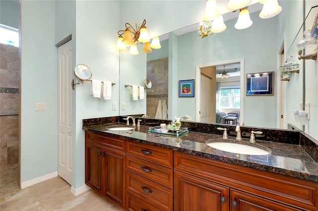 bathroom featuring vanity and tiled shower