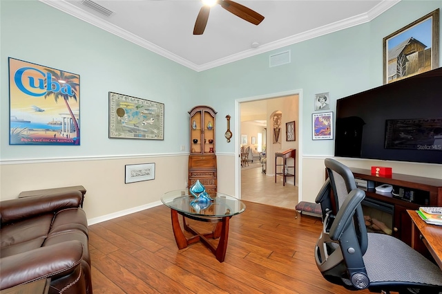 office space featuring ornamental molding, ceiling fan, and hardwood / wood-style flooring