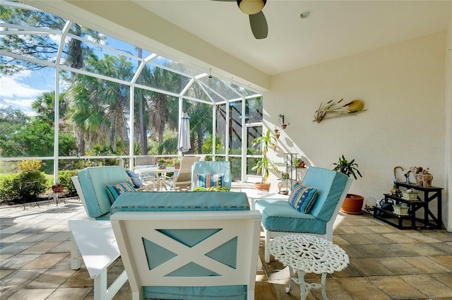 view of patio with ceiling fan and a lanai