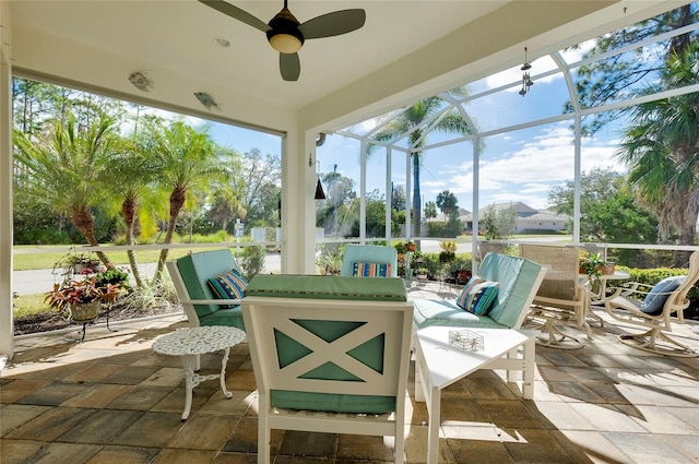 view of patio / terrace with glass enclosure and ceiling fan