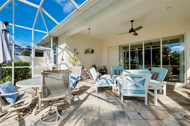 exterior space with beam ceiling and ceiling fan