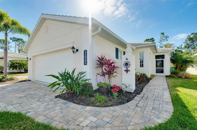 view of home's exterior featuring a yard and a garage