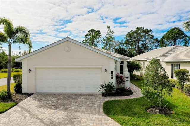 single story home featuring a garage