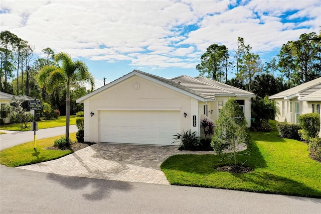 single story home featuring a front yard and a garage