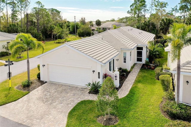 exterior space with a garage and a front lawn