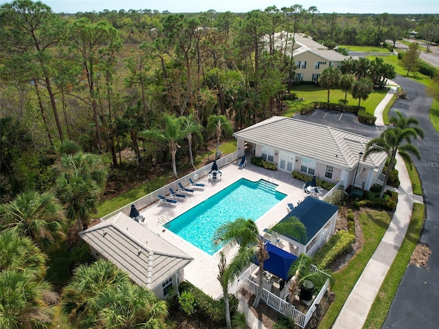 11065 Barnsley Dr, Venice, FL 34293 - pool with a patio, a forest view, and fence