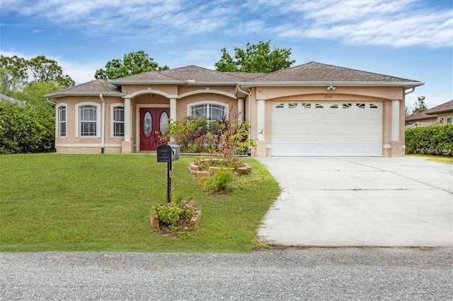 ranch-style home with a front yard and a garage