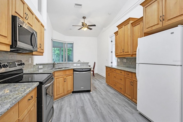 kitchen with backsplash, ceiling fan, light hardwood / wood-style floors, sink, and stainless steel appliances