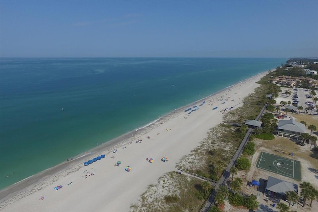 bird's eye view with a beach view and a water view