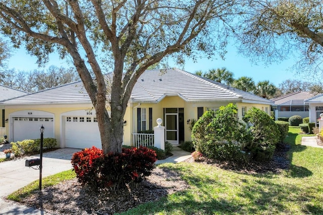 single story home featuring a front yard and a garage