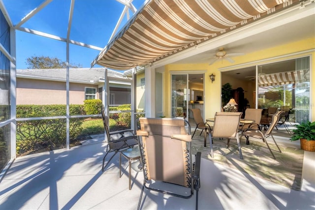 sunroom / solarium with ceiling fan