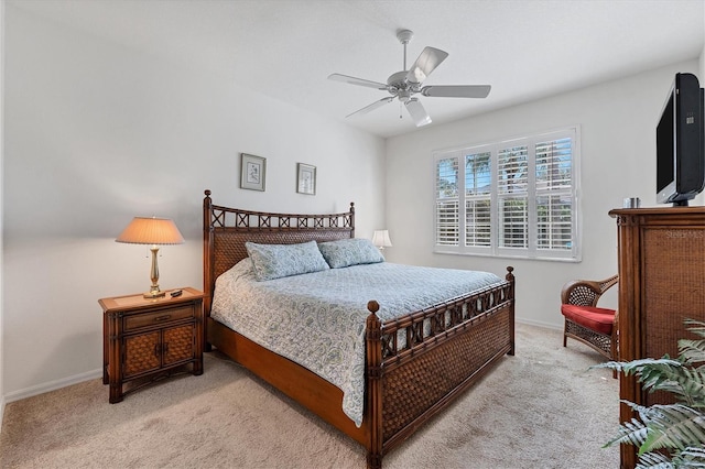 bedroom featuring light carpet and ceiling fan