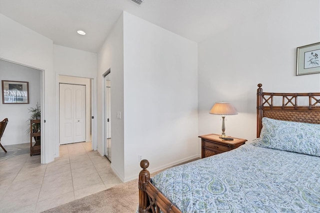 bedroom with light tile floors