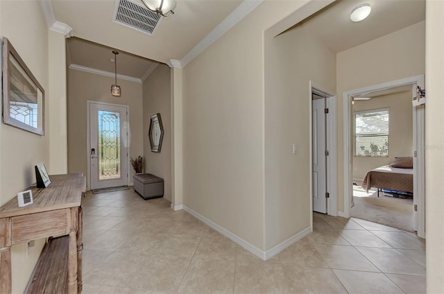 tiled entrance foyer with crown molding