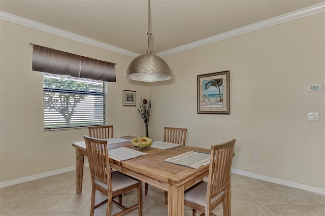 dining area featuring light tile patterned floors and ornamental molding