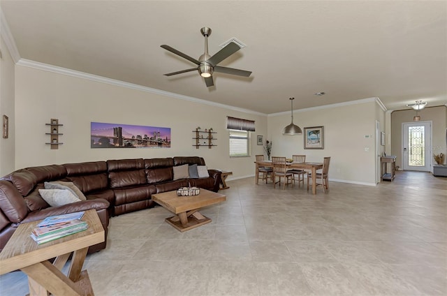 living room with ceiling fan, a healthy amount of sunlight, and crown molding