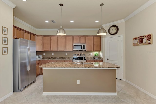 kitchen featuring stainless steel appliances, light stone counters, a kitchen island with sink, and sink