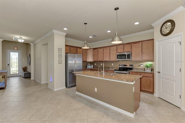 kitchen with a kitchen island with sink, sink, light stone countertops, ornamental molding, and appliances with stainless steel finishes