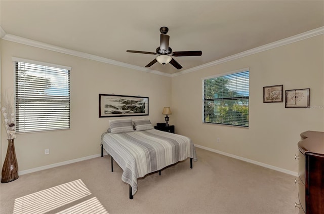 bedroom with light carpet, ceiling fan, and crown molding