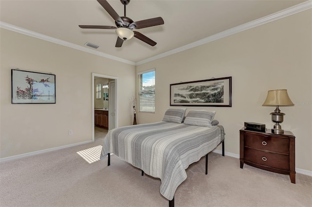 carpeted bedroom featuring ceiling fan, ornamental molding, and ensuite bath