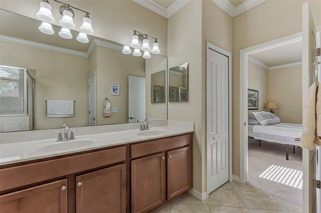 bathroom featuring tile patterned flooring, vanity, walk in shower, and ornamental molding