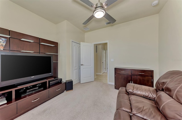 living room with ceiling fan and light colored carpet