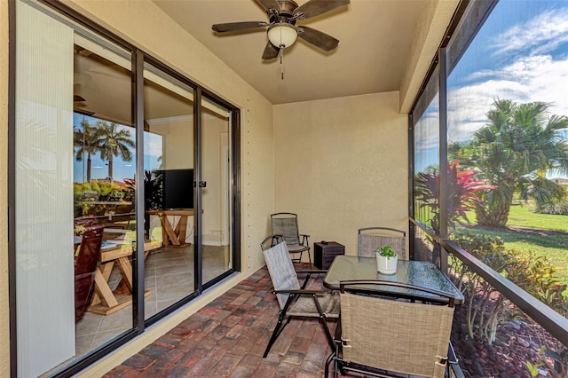 sunroom / solarium with ceiling fan