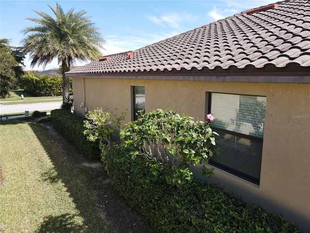 view of home's exterior with a lawn