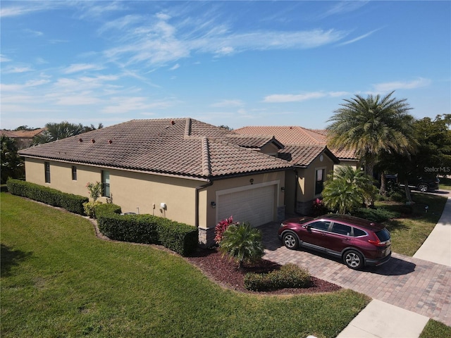 view of front of property with a garage and a front yard