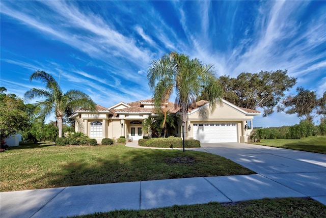 ranch-style house featuring a front lawn and a garage