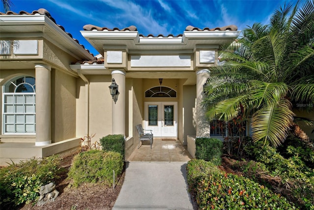 property entrance featuring french doors