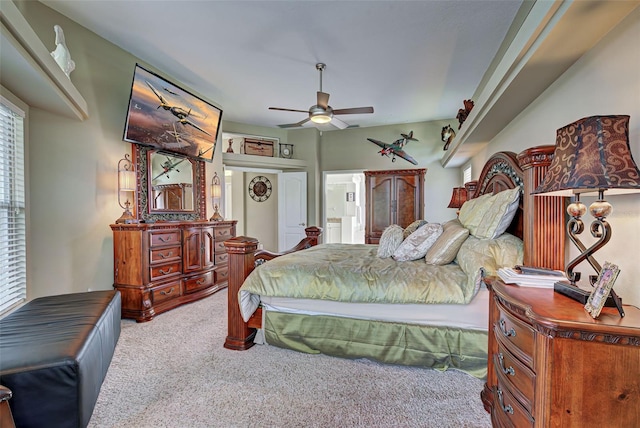 bedroom with light carpet and ceiling fan