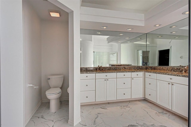 bathroom with double sink vanity, tile flooring, and toilet