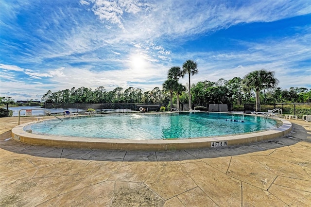 view of swimming pool with a patio