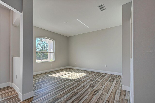 unfurnished room featuring light wood-type flooring