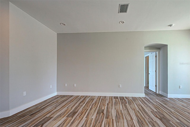 spare room with dark wood-type flooring