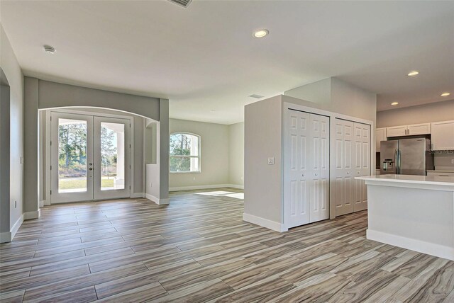 interior space featuring plenty of natural light and french doors