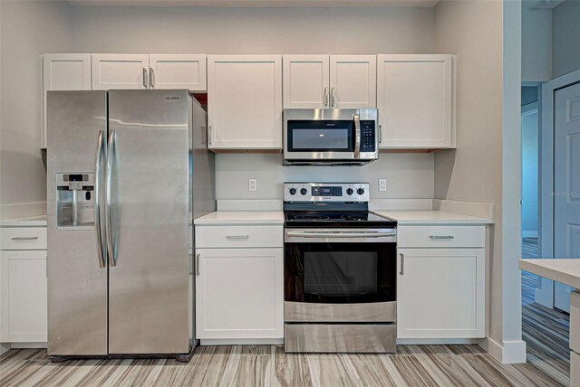 kitchen with white cabinets and stainless steel appliances