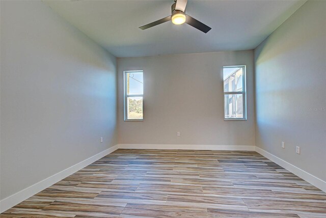 empty room featuring light hardwood / wood-style floors and ceiling fan