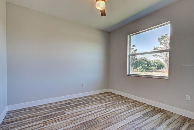 unfurnished room with ceiling fan