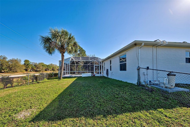 view of yard featuring a lanai