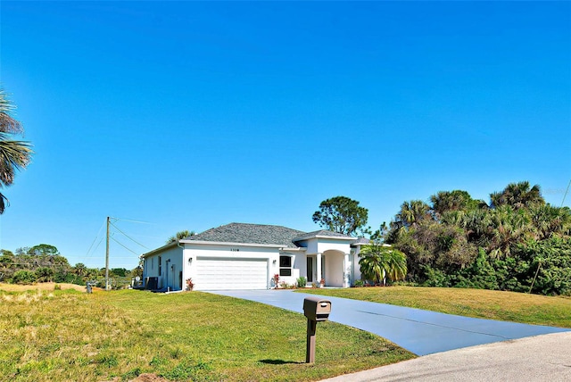 view of front facade with a front lawn and a garage